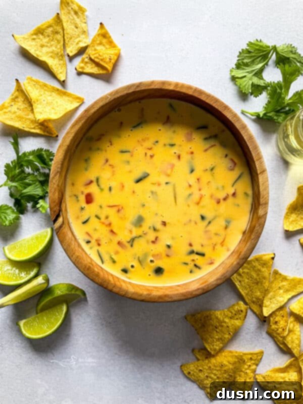 Homemade Qdoba Queso 4 Qdoba Dip with Lime Slices and Chips