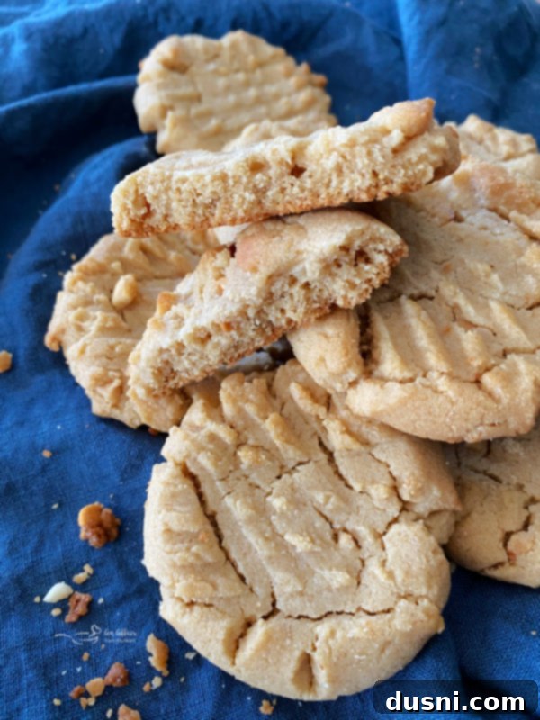 front view of a stack of Grandma Jane's peanut butter cookies on a cooling rack