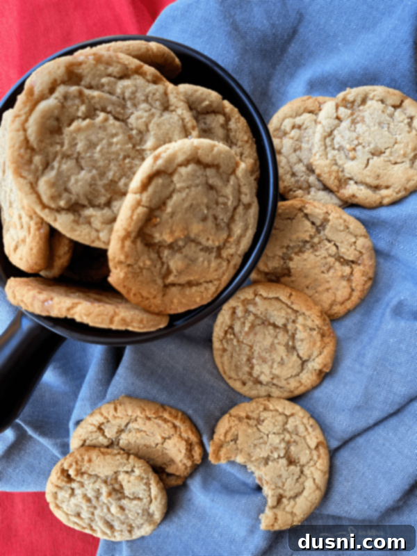 overhead shot of delicious butter brickle cookies in a bowl and scattered on a table