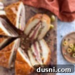 Sliced Muffuletta on a cutting board.