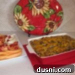 Close-up of a portion of the Sourdough Sausage Breakfast Casserole, showcasing its rich texture