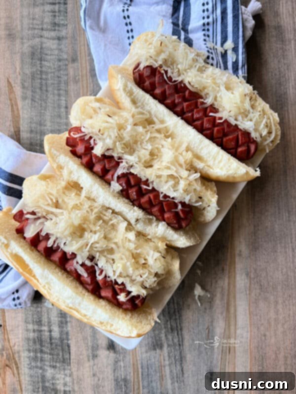 Smoky Franks with Tangy Kraut 2 Platter of smoked hot dogs and kraut in buns, garnished with caraway seeds