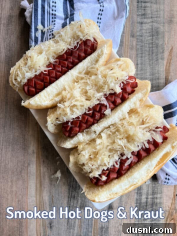 Smoky Franks with Tangy Kraut 21 Hero shot of smoked hot dogs and kraut in buns, perfect for summer grilling