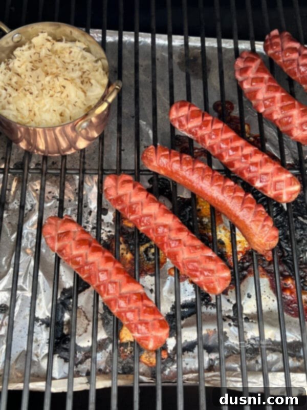 Smoky Franks with Tangy Kraut 10 Raw hot dogs with scoring marks and a dish of kraut with caraway seeds