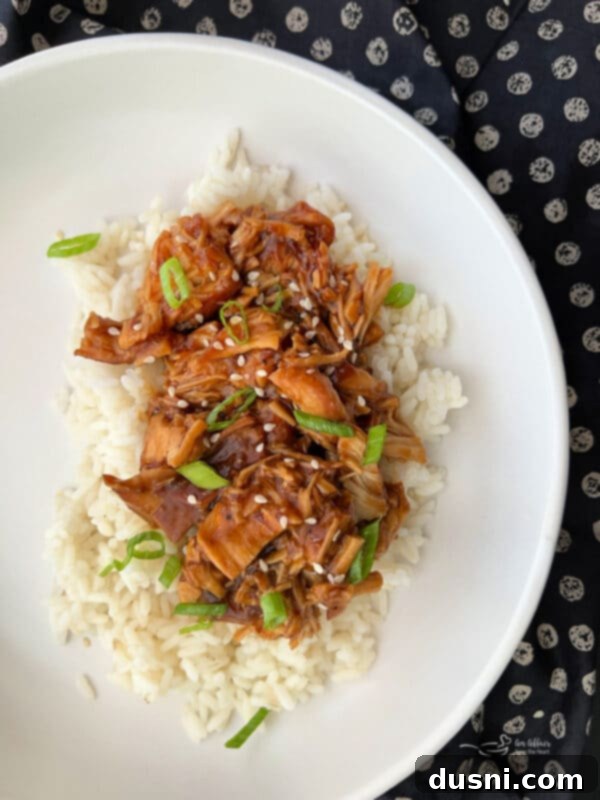 Slow Cooker Chicken Teriyaki served with rice and green onions