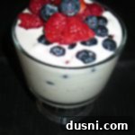 overhead of ice cream with berries in it