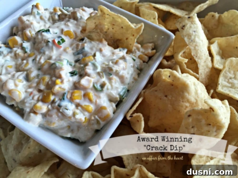 Dip in a white serving dish with chips around it and text "award winning crack dip"