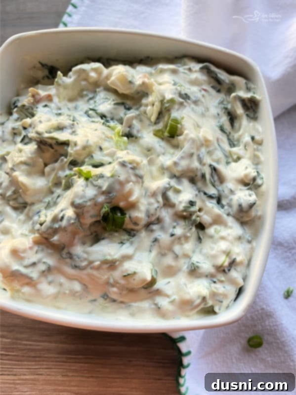 white bowl with spinach dip