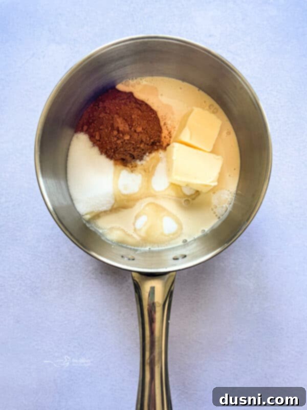 Lining a baking pan with parchment paper for no-bake cookie bars.