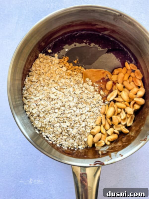 Boiling sugar, cocoa, milk, and butter for no-bake cookie bars.