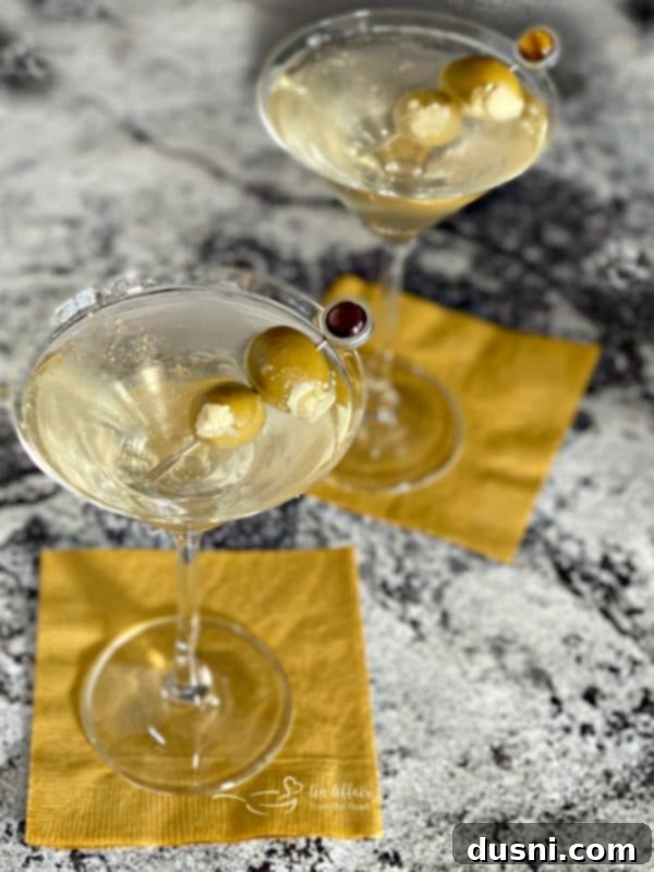 The Brine-Kissed Vodka Martini 3 2 Dirty Vodka Martinis with bleu cheese stuffed olives, a luxurious cocktail experience