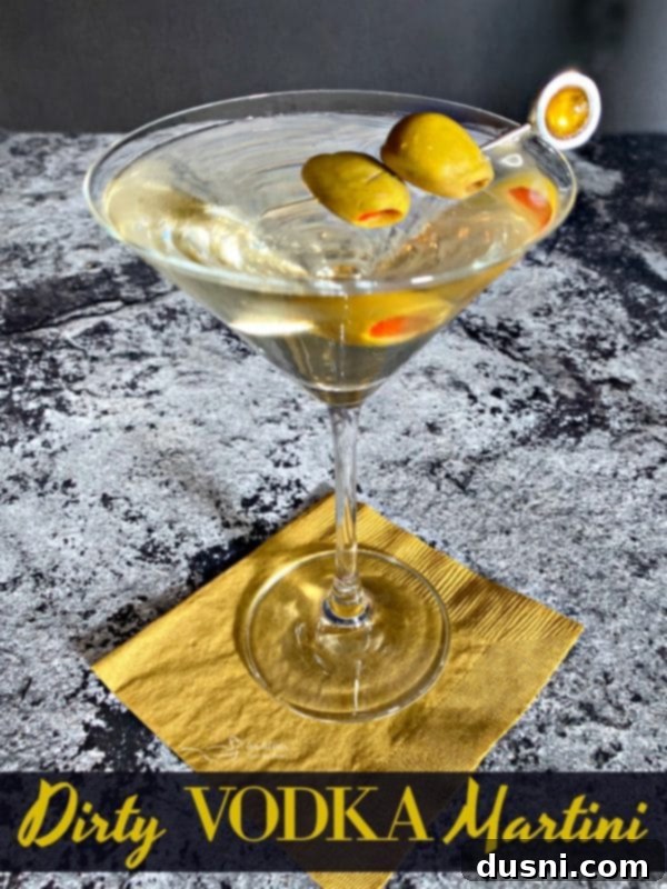 The Brine-Kissed Vodka Martini 9 Dirty Vodka Martini with Spanish Olives, a close-up of the delicious garnish