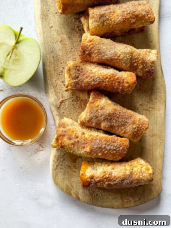 Air Fried Apple Pie Egg Rolls 14 Stack of Air Fryer Apple Pie Egg Rolls with caramel sauce