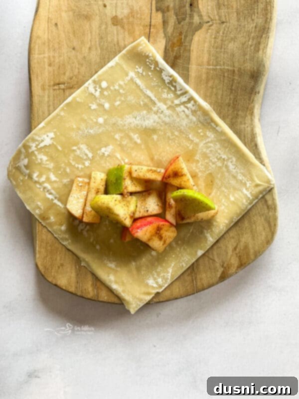 Air Fried Apple Pie Egg Rolls 6 Apple pie filling mixed in a bowl