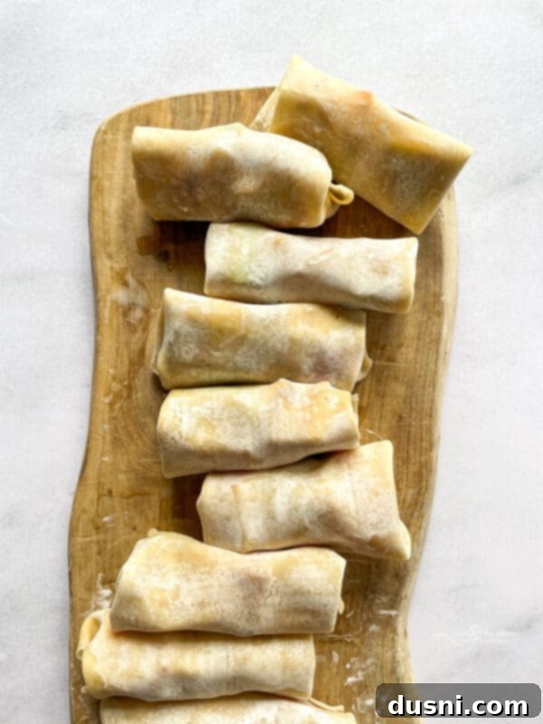 Air Fried Apple Pie Egg Rolls 7 Folding an apple pie egg roll wrapper with filling