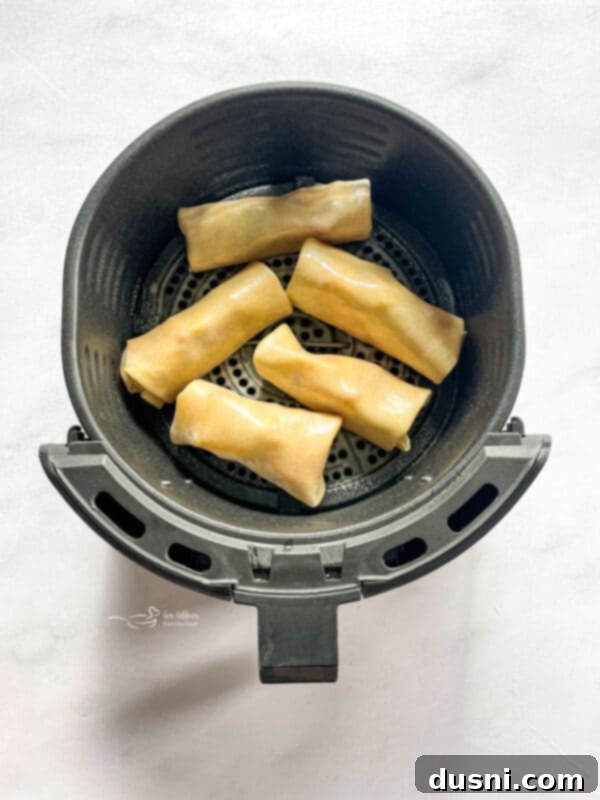 Air Fried Apple Pie Egg Rolls 8 Folding and sealing an apple pie egg roll