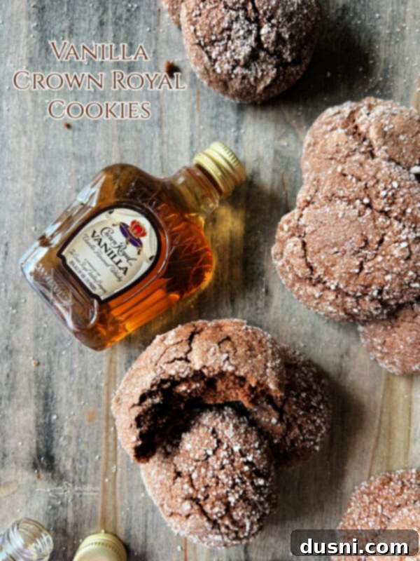 Two Vanilla Crown Royal Cookies on a white background with a small bottle of Crown Royal Vanilla
