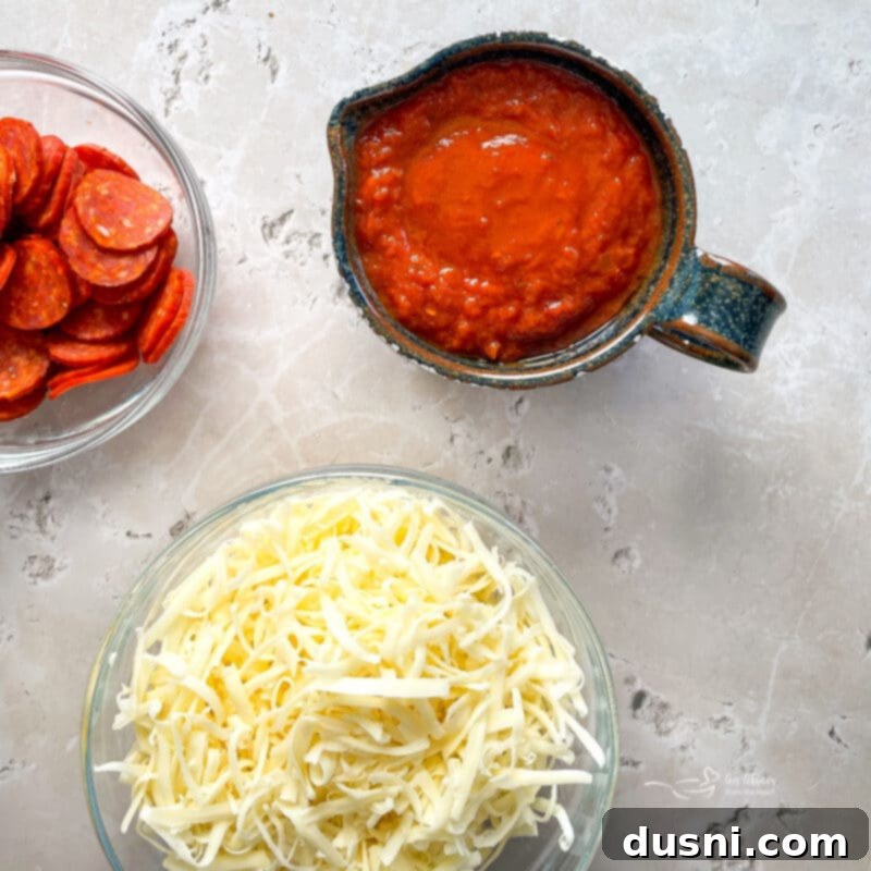 Homemade Detroit Style Pizza Perfection 5 Ingredients for Detroit Style Pizza, including cheese, pepperoni, and sauce.