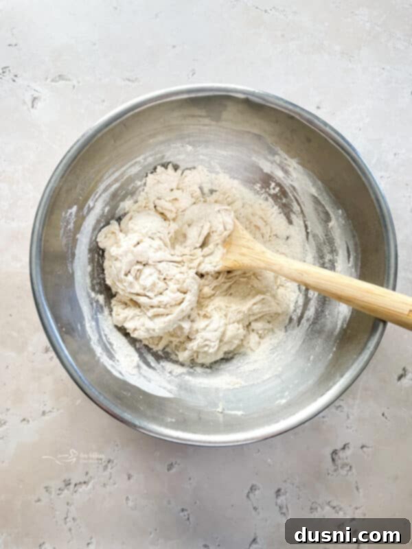 Homemade Detroit Style Pizza Perfection 7 Mixing flour and salt in a bowl for Detroit Style Pizza dough.