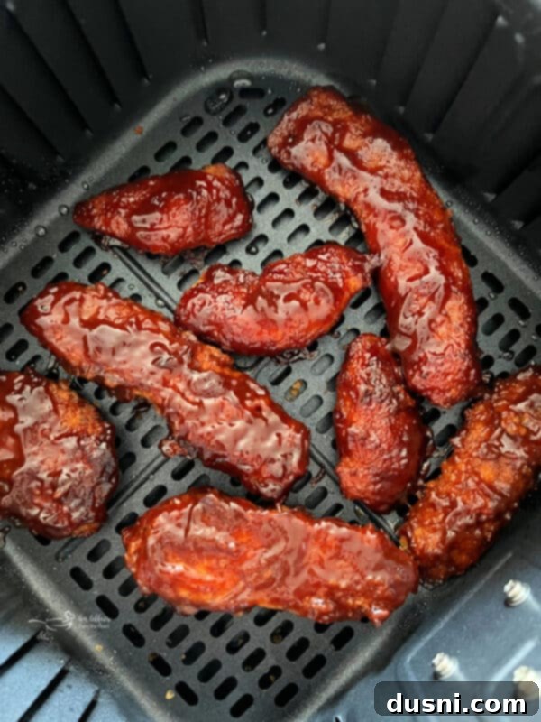 Golden crispy Air Fryer BBQ Chicken Tenders on a plate