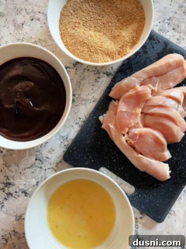 Air fryer basket filled with BBQ chicken tenders