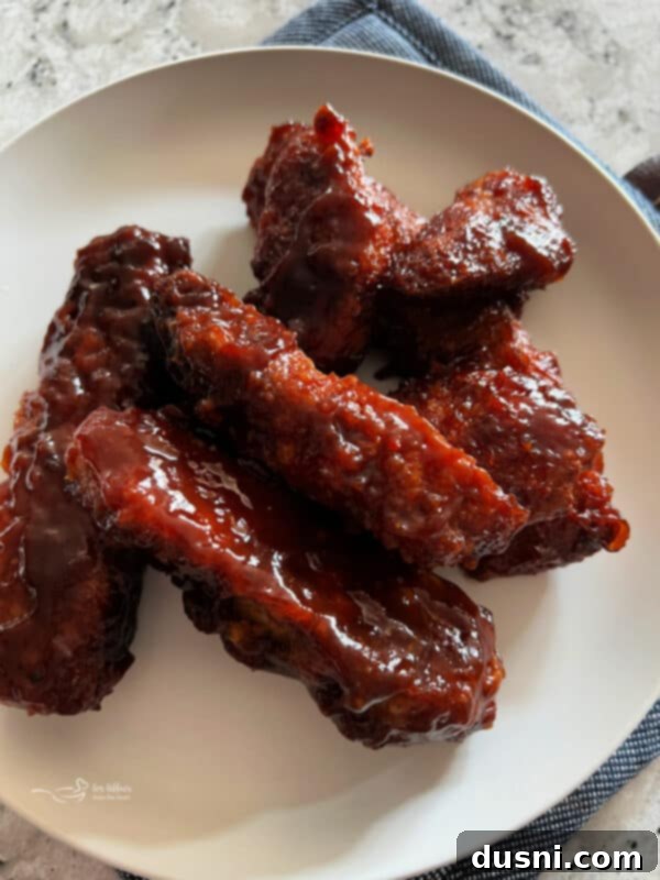 Chicken tenders coated in breadcrumbs, ready for air frying