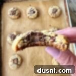 Ultimate Reese's Peanut Butter Cookies 14 Close up of a bite out of a Reese's Peanut Butter Cup Cookie.