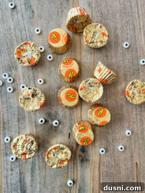 Close-up of ingredients: Reese's Minis, chocolate chips, and candy eyeballs