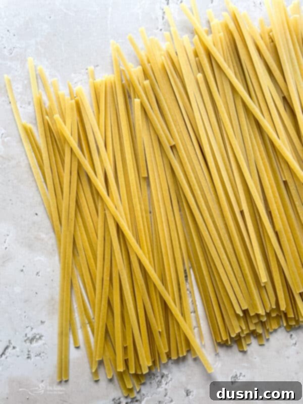Overhead shot of Instant Pot Fettuccine Alfredo in a white serving dish.