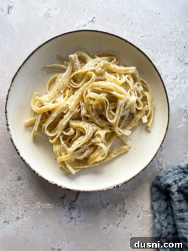 Mixing the Instant Pot Fettuccine Alfredo ingredients before cooking.
