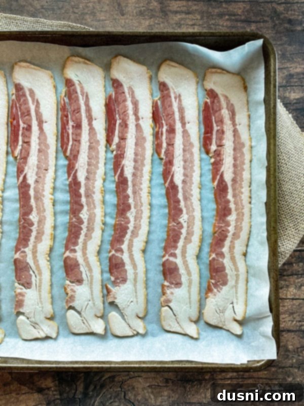 Ingredients for Bacon and Swiss Quiche, showing bacon strips, Swiss cheese, and onion