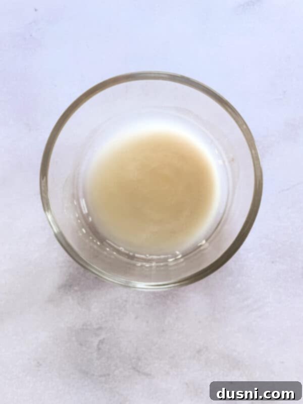 Artisan Pizza Base 4 Water in a large bowl, ready for the yeast activation process.