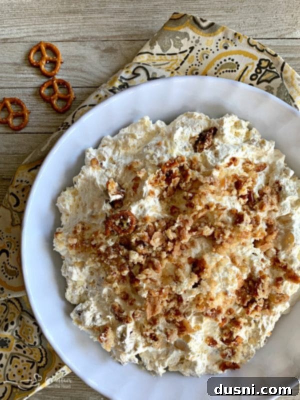 Sweet & Salty Pineapple Cloud 2 Delicious Pineapple Pretzel Fluff dessert in a glass bowl
