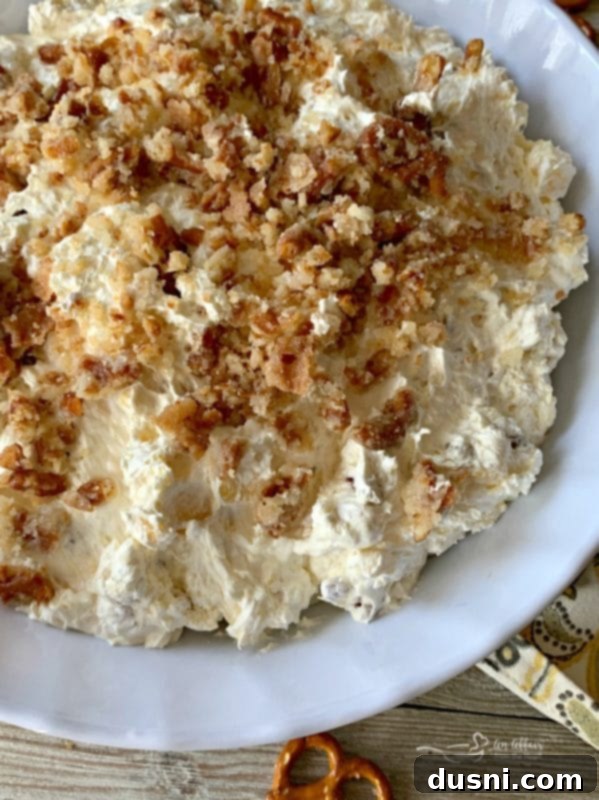 Sweet & Salty Pineapple Cloud 3 Serving of Pineapple Pretzel Fluff in a white bowl with spoon