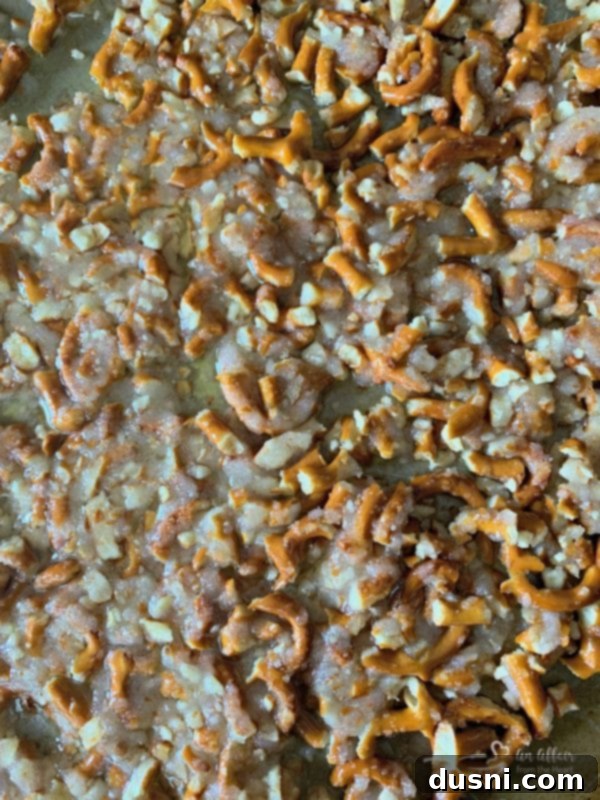 Sweet & Salty Pineapple Cloud 5 Baked pretzel crumble cooling on a baking sheet