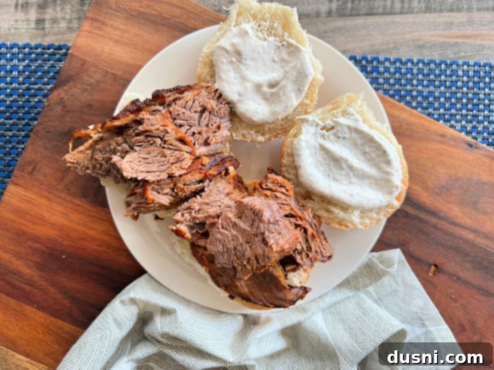 Texas Heat Smoked Brisket 14 Adding a generous dollop of homemade horseradish sauce to a brisket slider.