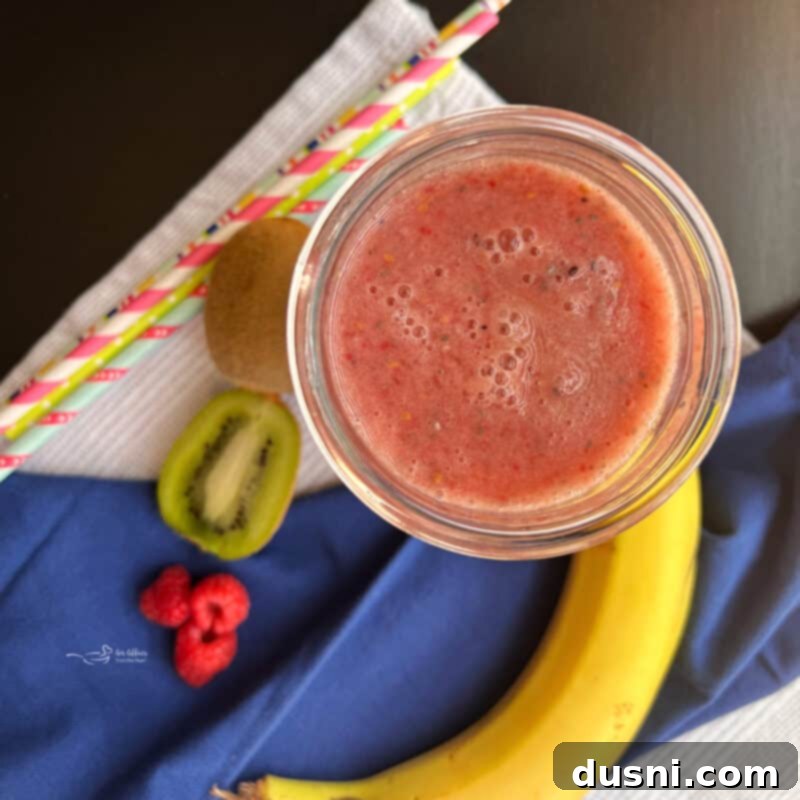 High Fiber Smoothie in a glass with ingredients around it