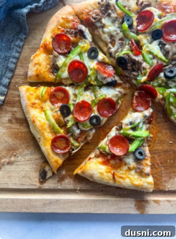 A glorious Supreme Pizza, perfectly baked with golden crust and bubbly cheese, ready to be sliced.