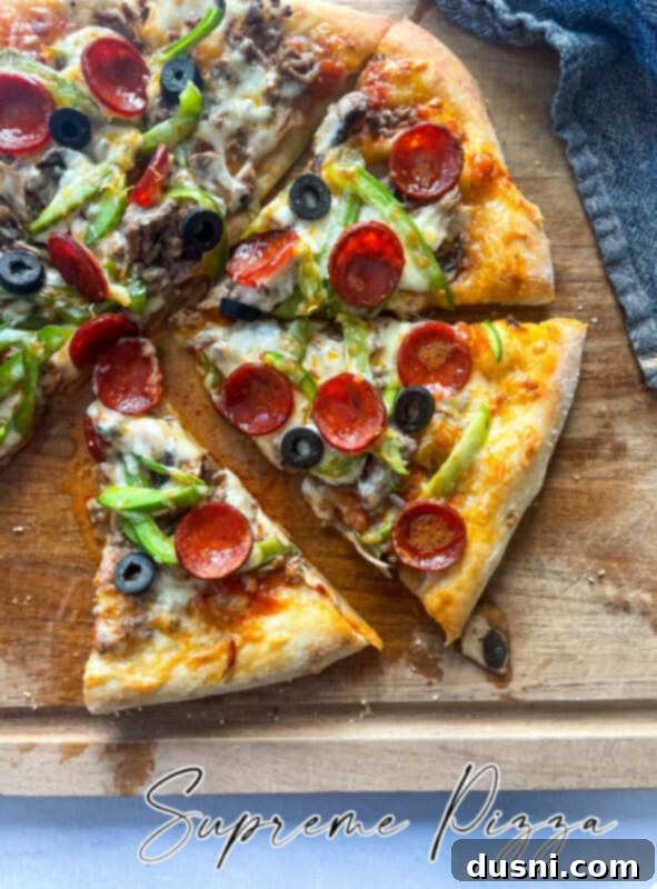 A whole Homemade Supreme Pizza, artfully arranged and ready to be served, capturing its rich toppings and golden crust.