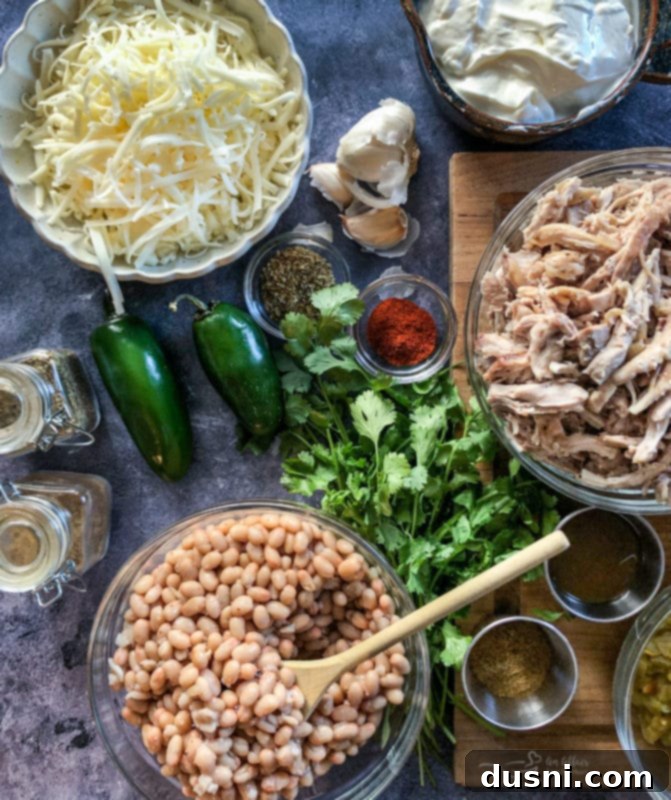 Creamy White Chicken Chili 4 Another close-up shot of the white chicken chili, highlighting the creamy texture and fresh herbs on top.