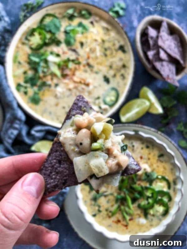 Creamy White Chicken Chili 8 A slow cooker filled with white chicken chili, ready to be served.