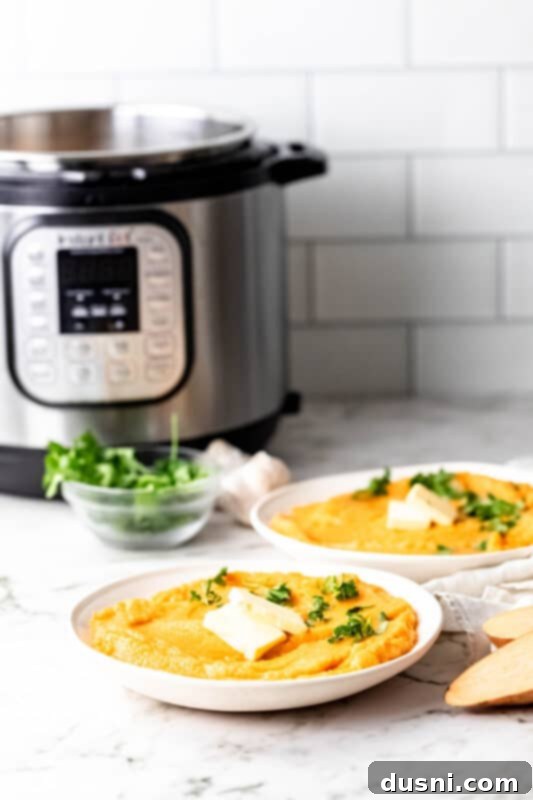 Close-up of Instant Pot Sweet Potato Mash in a white bowl with fresh parsley