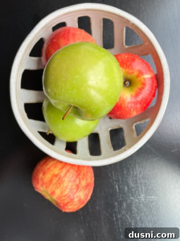 Decadent Snickers Apple Salad 5 Ingredients for Snicker Apple Salad laid out on a table