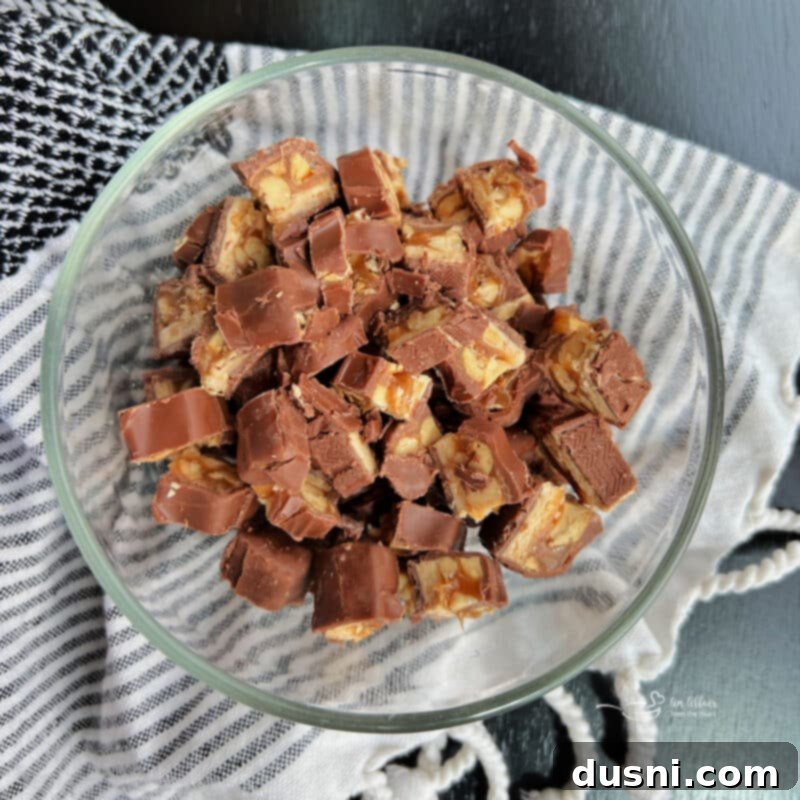 Decadent Snickers Apple Salad 9 Step two: Chopping Snickers candy bars into generous pieces