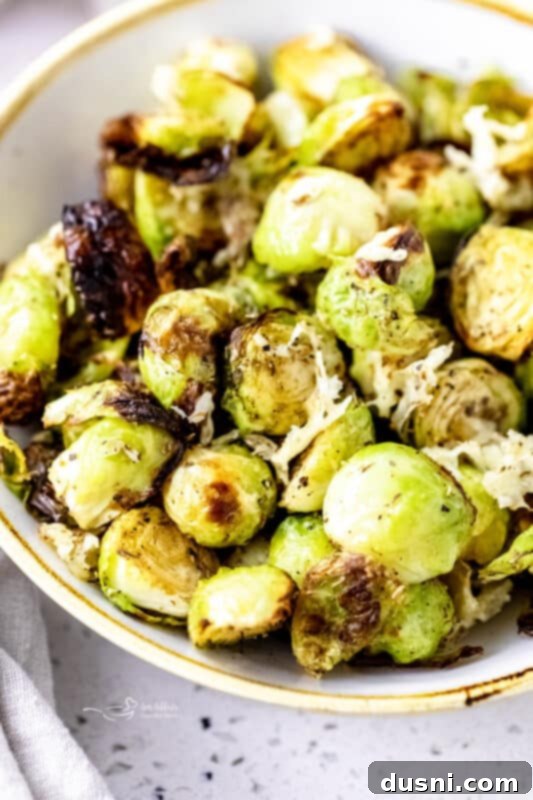 Air Fryer Brussels Sprouts with Parmesan, a close-up shot showing crispy edges.