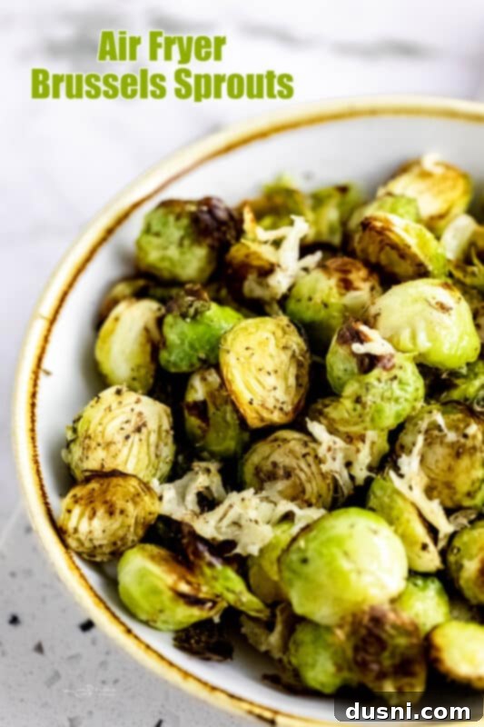 A serving of air fryer Brussels sprouts on a plate, with a fork.