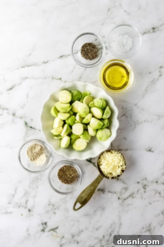 A cutting board with fresh Brussels sprouts and garlic, ready for preparation.