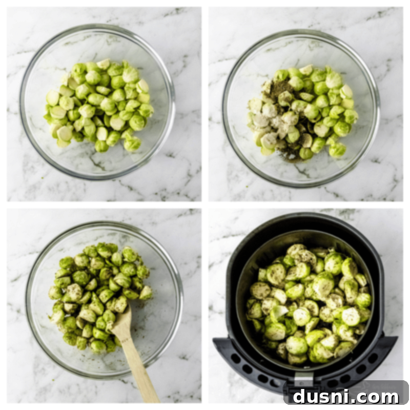 Brussels sprouts being mixed with olive oil and seasonings in a large bowl.