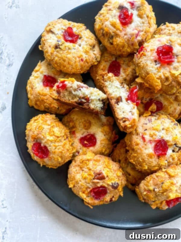 Cherry Wink Cookies stacked on a blue serving plate.