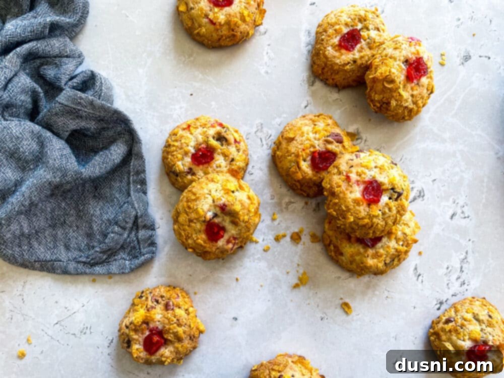 Overview shot of Cherry Wink Cookies on a cooling rack and a plate.